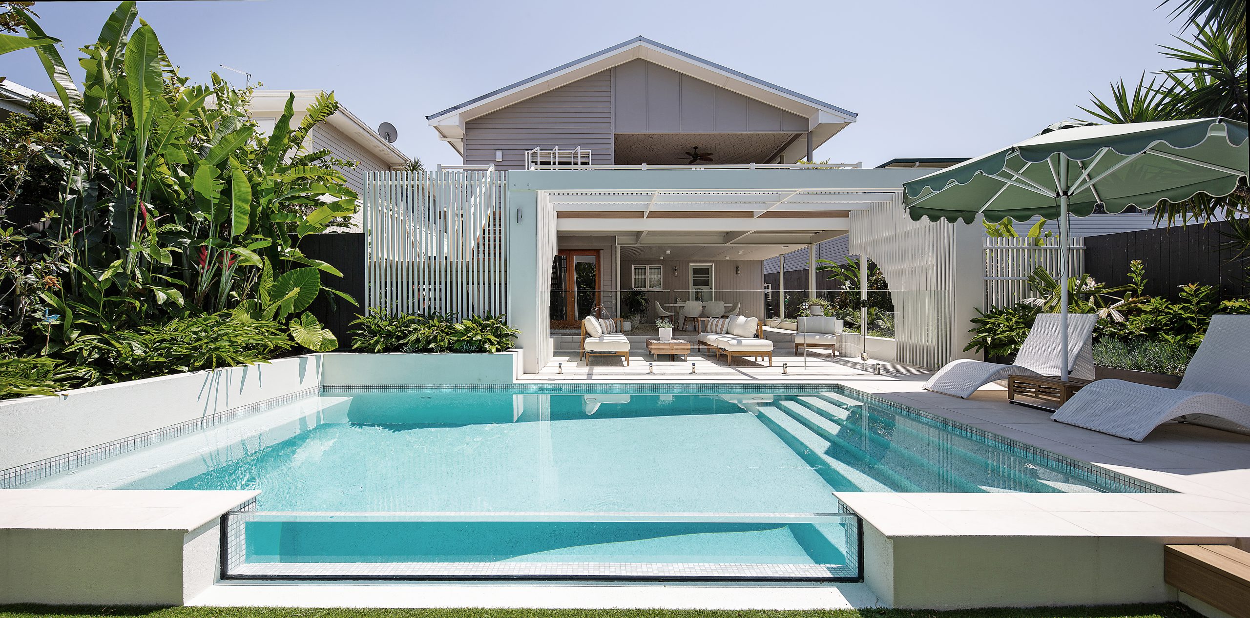 Pool landscape design with privacy planting and outdoor living